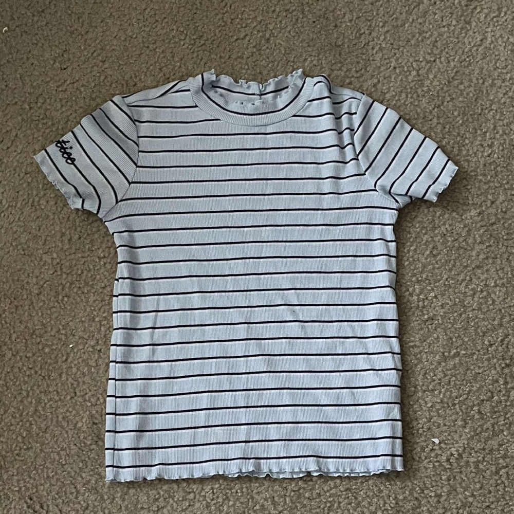 It’s blue with dark blue stripes from Justic